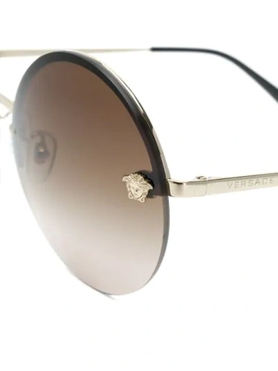 Shop Versace Round Shaped Sunglasses In Metallic