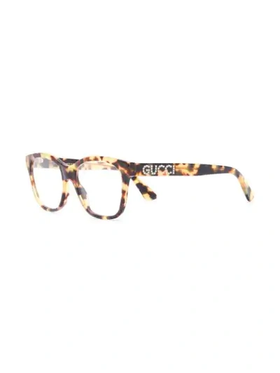 Shop Gucci Rectangle Frame Glasses In 棕色