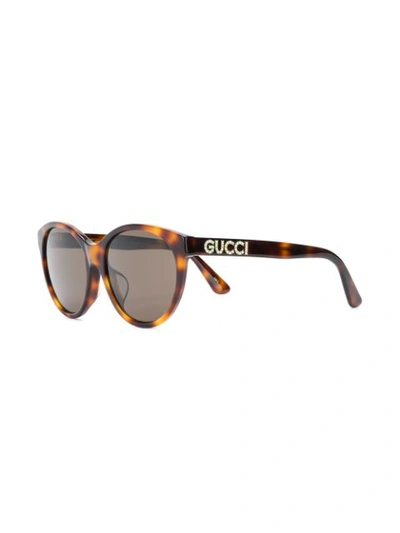 Shop Gucci Cat-eye Sunglasses In Brown