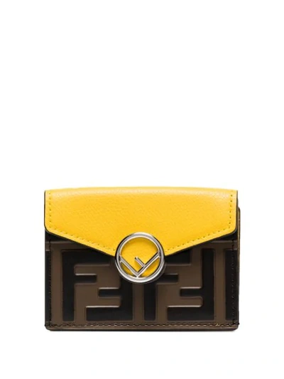 Shop Fendi Ff-embossed Trifold Wallet In Yellow