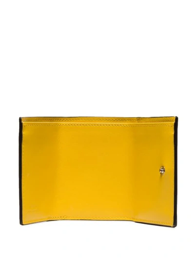 Shop Fendi Ff-embossed Trifold Wallet In Yellow