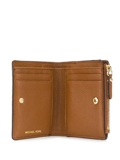 Shop Michael Michael Kors Compact Logo Wallet In Brown