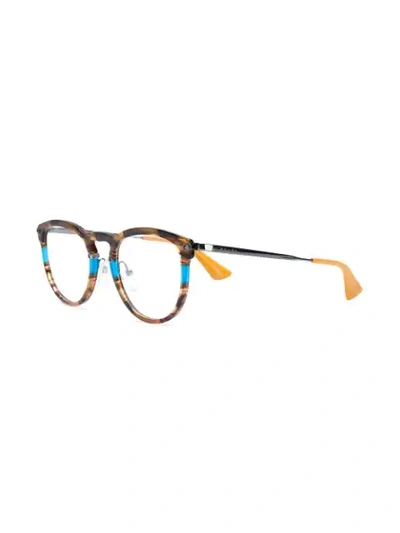 Shop Prada Round Frame Glasses In Brown