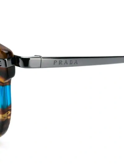 Shop Prada Round Frame Glasses In Brown