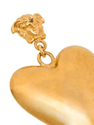 Shop Versace Tribute Heart Drop Earrings In Metallic
