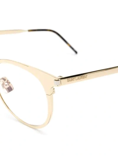 Shop Saint Laurent Round Frame Glasses In Gold