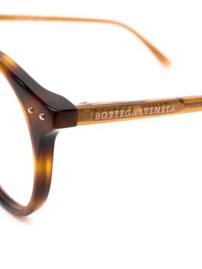 Shop Bottega Veneta Round Frame Glasses In Brown