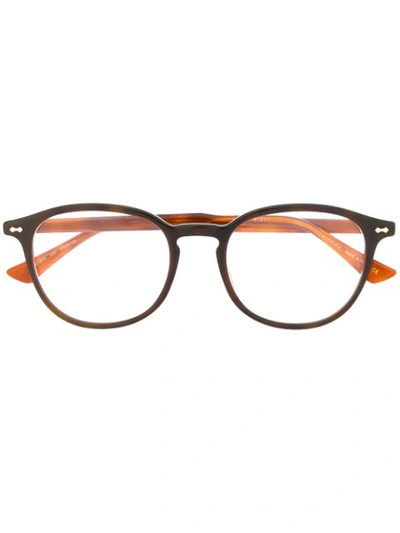 Shop Gucci Oval Frame Glasses In Brown