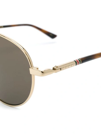 Shop Gucci Aviator Frame Sunglasses In Gold
