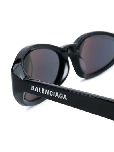 Shop Balenciaga Oval Sunglasses In Black