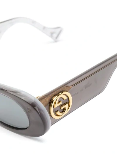 Shop Gucci Oval Frame Sunglasses In Grey