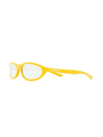 Shop Balenciaga Narrow Oval-frame Sunglasses In Yellow