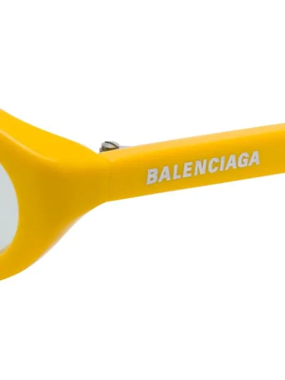 Shop Balenciaga Narrow Oval-frame Sunglasses In Yellow