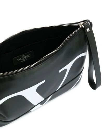 Shop Valentino Garavani Go Logo Clutch In Black