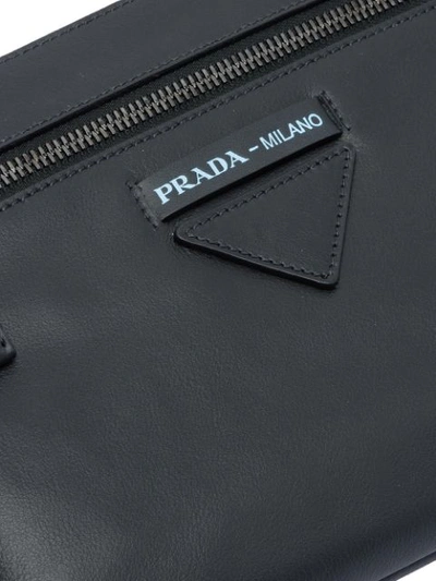 Shop Prada Logo Plaque Clutch Bag In Schwarz