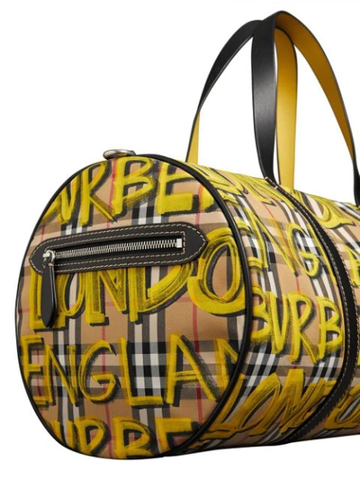 Shop Burberry Graffiti Print Check Bag In Yellow