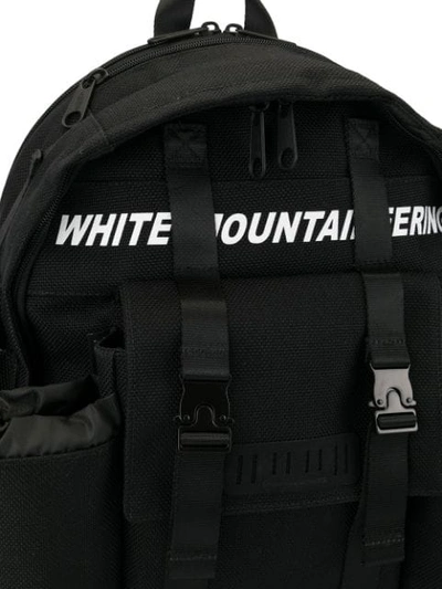 Shop White Mountaineering Logo Print Backpack In Black