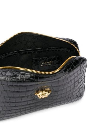 Shop Versace Embossed Crocodile-effect Medusa Clutch In Black
