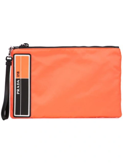 Shop Prada Logo Clutch Bag In Orange