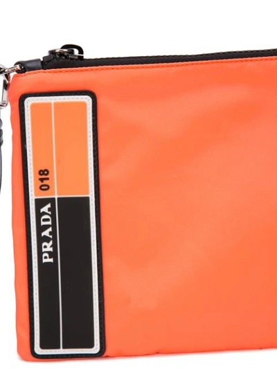 Shop Prada Logo Clutch Bag In Orange