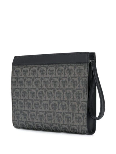 Shop Ferragamo Logo Print Clutch Bag In Black ,grey