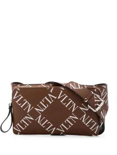 Shop Valentino Garavani Grid Logo Belt Bag In Brown