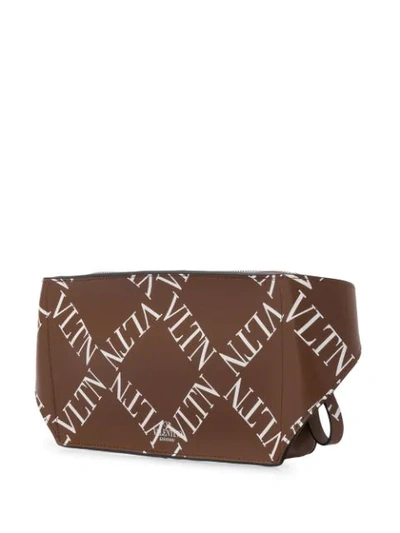 Shop Valentino Garavani Grid Logo Belt Bag In Brown