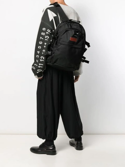 Shop Yohji Yamamoto Logo Patch Backpack In Black