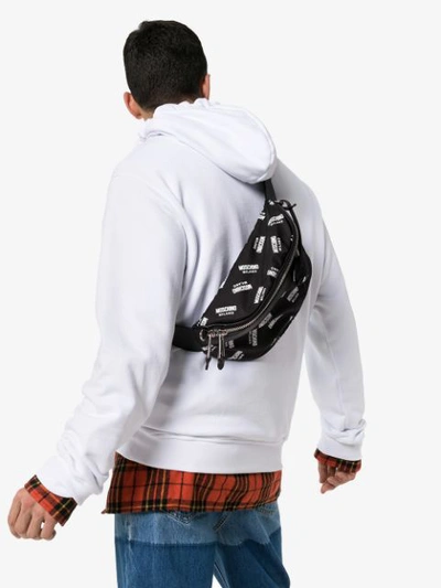 Shop Moschino Black And White Logo Print Cross Body Bag