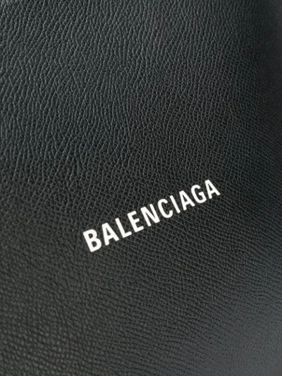 Shop Balenciaga Embossed Logo Clutch In Black