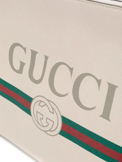 Shop Gucci Logo Print Clutch In Neutrals
