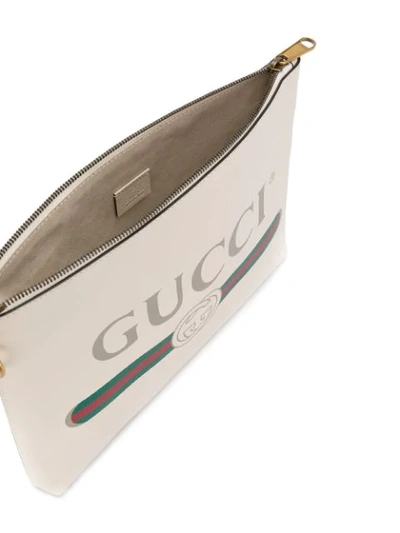 Shop Gucci Logo Print Clutch In Neutrals
