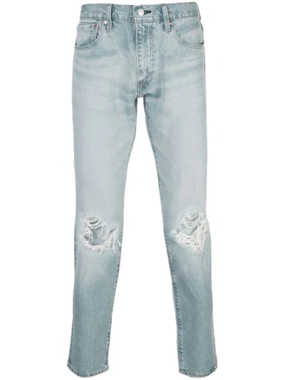 Shop Levi's Ripped Detail Tapered Jeans In Blue