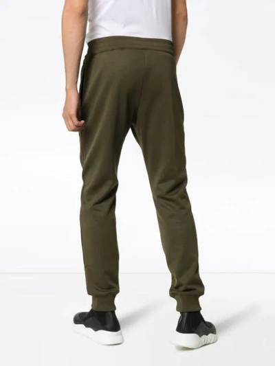 Shop Moschino Slim-fit Logo Track Trousers In Green