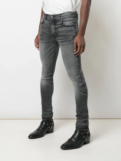 Shop Amiri Stack Skinny Jeans In Vintage Grey