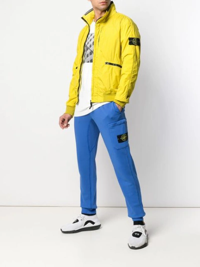 Shop Stone Island Logo Bomber Jacket In Yellow