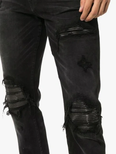 Shop Amiri Distressed Jeans In Black