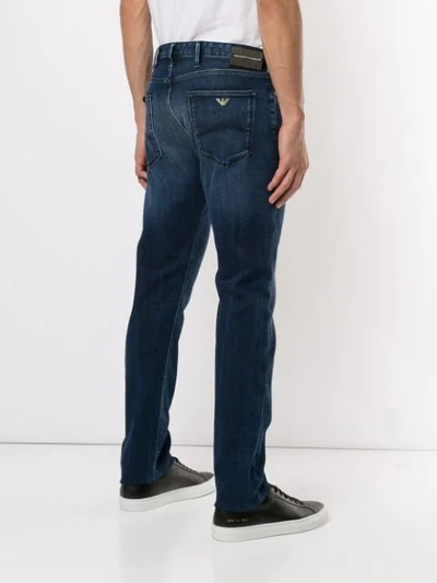 Shop Emporio Armani Faded Detail Jeans In Blue