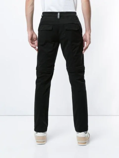 Shop Kenzo Knee Pleat Detail Trousers In Black
