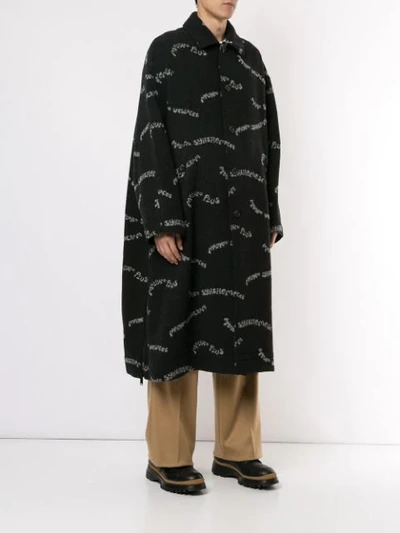 Shop Undercover Slogan Print Coat In Black