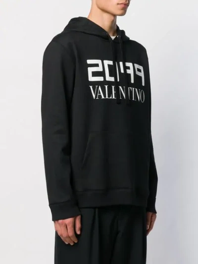 Shop Valentino 2099 Logo Printed Hoodie In Black