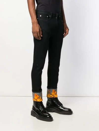 Shop Neil Barrett Flame Jeans In Black