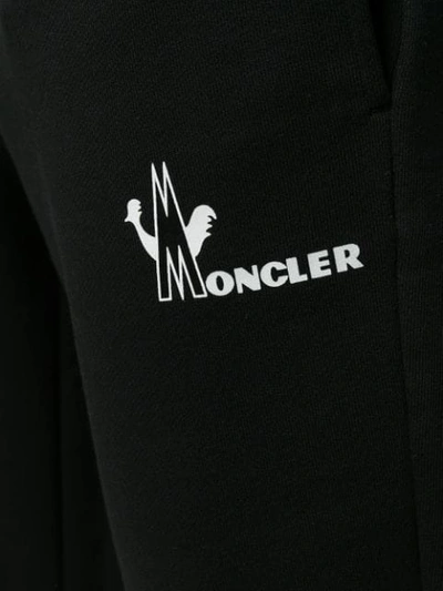 Shop Moncler Logo Print Track Pants In 999 Black