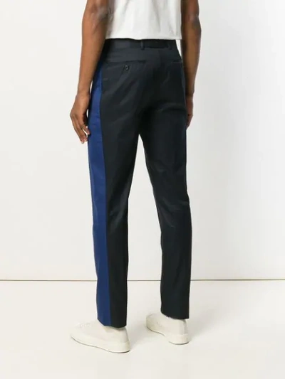 Shop Alexander Mcqueen Stripe Trousers In Blue