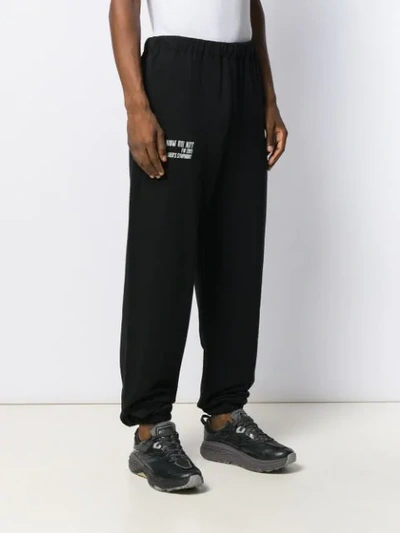 Shop Ih Nom Uh Nit Logo Print Track Pants In Black