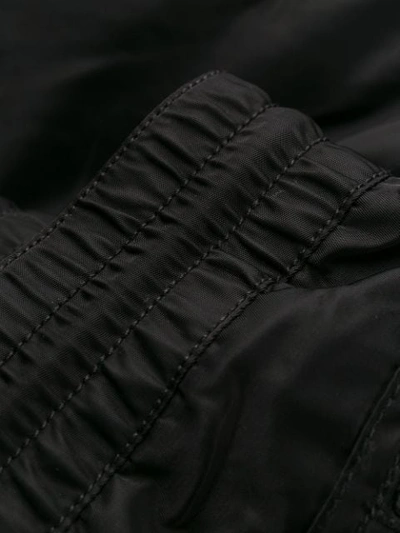 Shop Diesel Tapered Trousers In 900 Black