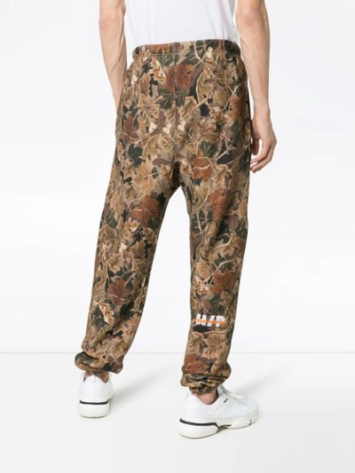 Heron Preston Ctnmb Leaf-print Cotton-jersey Track Pants In Brown