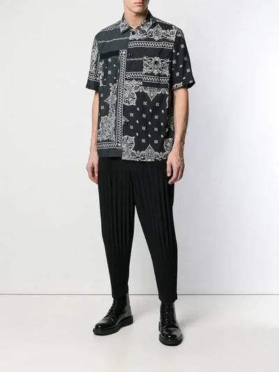 Shop Issey Miyake Pleated Drropped Crotch Trousers In Black