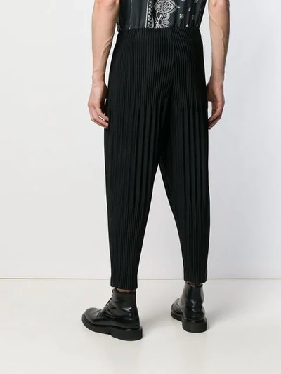 Shop Issey Miyake Pleated Drropped Crotch Trousers In Black