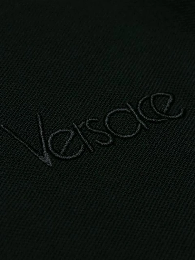 Shop Versace Front Zipped Polo Shirt - Black